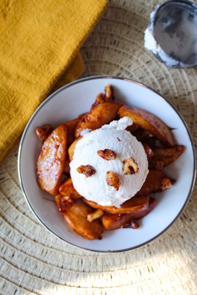 Warm cinnamon apples with walnuts and vanilla icecream